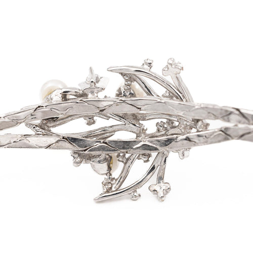 Bracelet Bracelet vintage motif feuillage en or blanc 18 carats, diamants et perles 58 Facettes 1142143CN