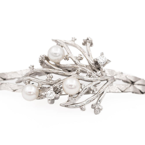 Bracelet Bracelet vintage motif feuillage en or blanc 18 carats, diamants et perles 58 Facettes 1142143CN