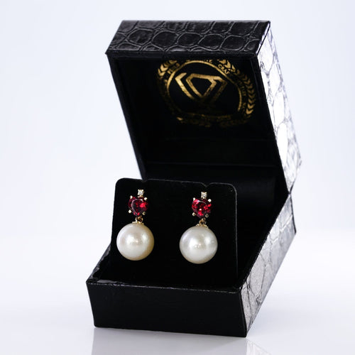Boucles d'oreilles Boucles d'oreilles - Perles des mers du Sud, grenats et diamants en or jaune 58 Facettes E007