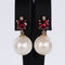 Boucles d'oreilles Boucles d'oreilles - Perles des mers du Sud, grenats et diamants en or jaune 58 Facettes E007