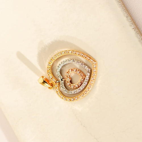 Tricolor heart pendant in 14-carat gold with diamonds 58 Facettes