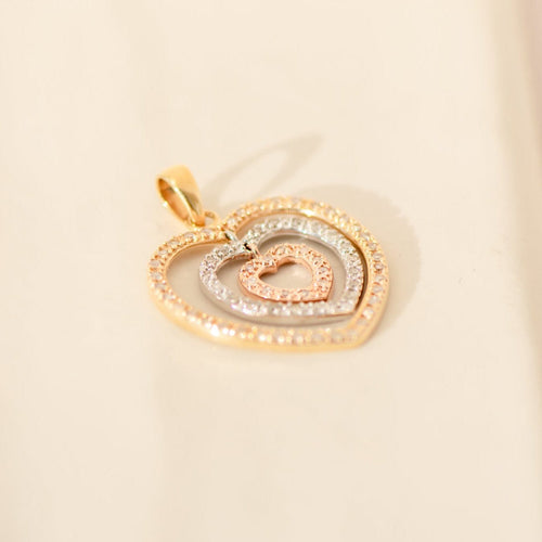 Tricolor heart pendant in 14-carat gold with diamonds 58 Facettes