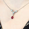 Collier Collier en or blanc 18 carats avec diamants et rubis 58 Facettes 29573