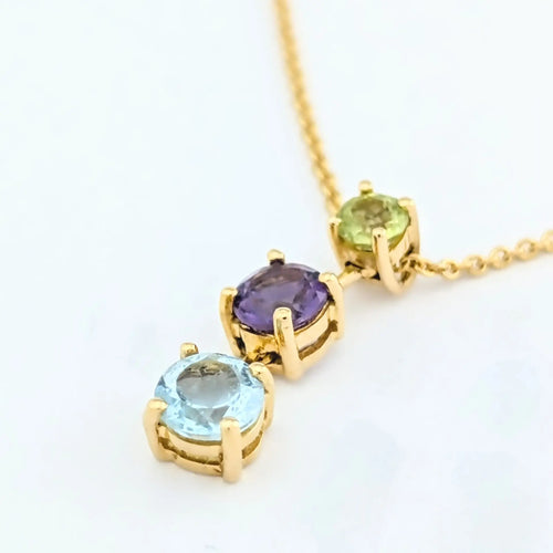 Collier Collier en or jaune 18 carats avec aigue-marine, améthyste et péridot 58 Facettes 31899