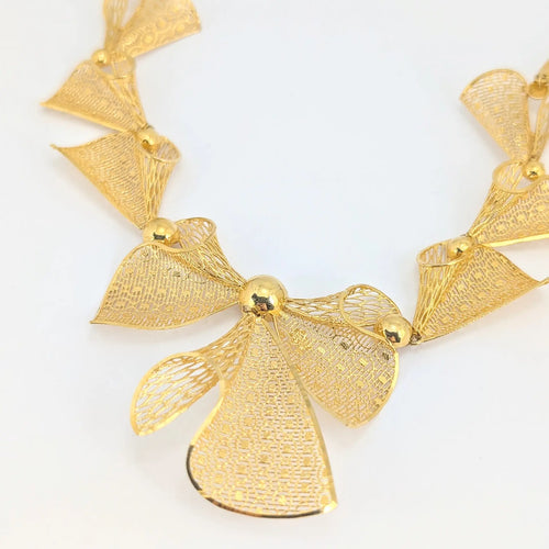 Collier Collier nœuds en or jaune 18 carats 58 Facettes 31901