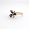 https://18carats.fr/wp-content/uploads/2026/01/34423-34457-Bague-fleur-en-or-jaune-saphirs-et-diamants.png