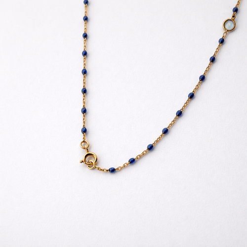 https://18carats.fr/wp-content/uploads/2026/01/34651-34658-Collier-en-or-jaune-lapis-lazuli-et-topaze.png