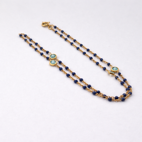 https://18carats.fr/wp-content/uploads/2026/01/34651-34660-Collier-en-or-jaune-lapis-lazuli-et-topaze.png