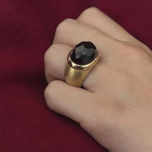 Bague Pomellato - Bague bande en or jaune avec grenat 58 Facettes 36427