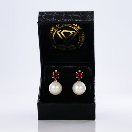 Boucles d'oreilles Boucles d'oreilles - Perles des mers du Sud, grenats et diamants en or jaune 58 Facettes E007