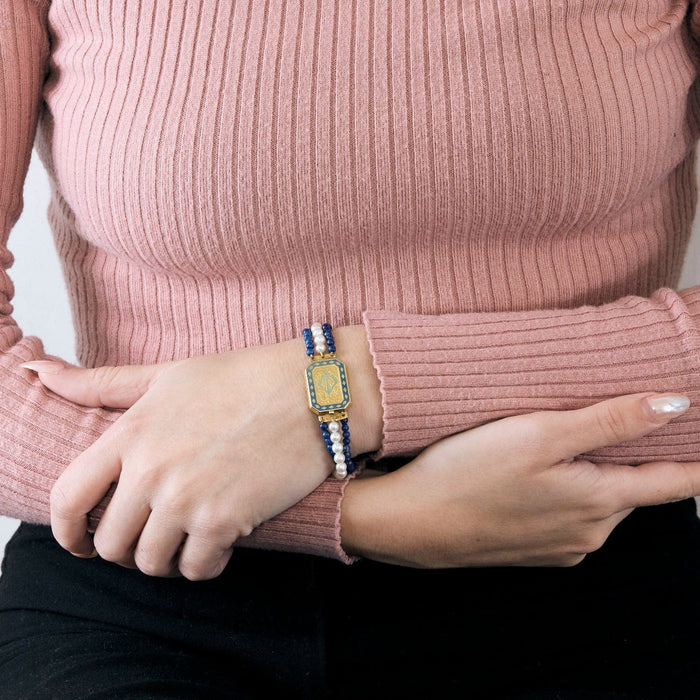 Bracelet Bracelet or jaune 18K,perles blanches et de lapis-lazuli 58 Facettes DV5673-3