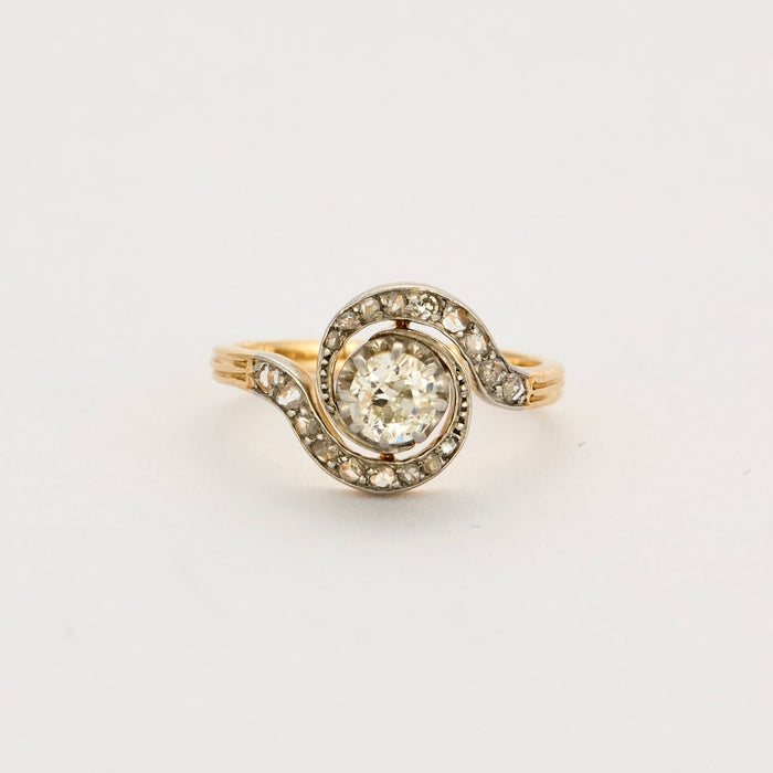 Gold and diamond swirl ring