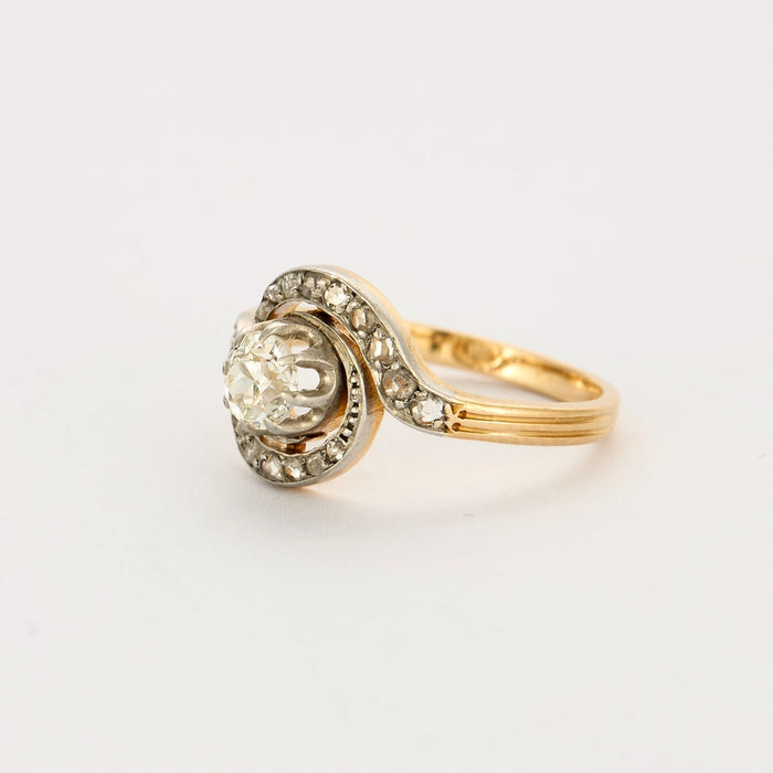 Gold and diamond swirl ring