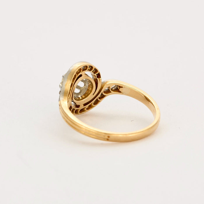 Gold and diamond swirl ring