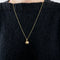 Pendentif "boule"  en or jaune sertie de diamants