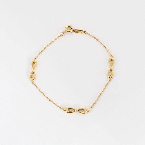 Bracelet TIFFANY & CO- Bracelet Infiniti - or jaune 58 Facettes DV10358-5