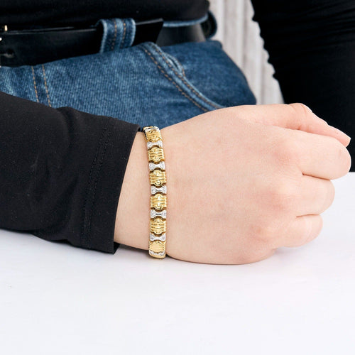 Bracelet Bracelet en or jaune, or gris et diamants 58 Facettes DV0984-6