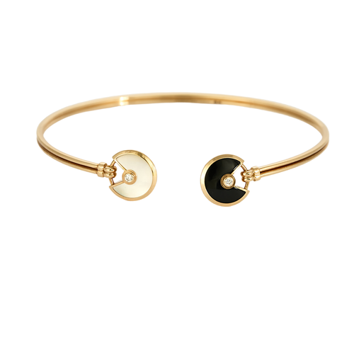 CARTIER - Amulette - Bracelet jonc ouvert en or rose, onyx, nacre et diamants