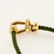 Bracelet FRED - FORCE 10 - Moyen modèle - Bracelet en or jaune et cordon torsadé en acier vert 58 Facettes DV18445-7