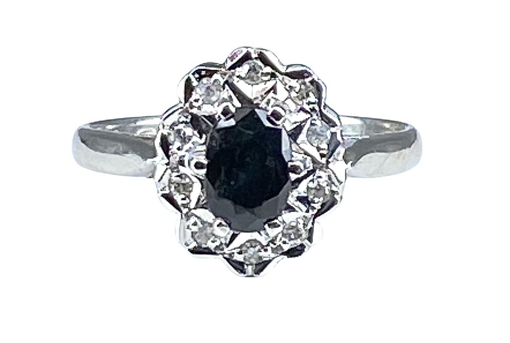 White gold sapphire and 10 diamond ring