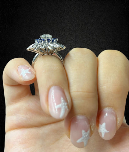 Bague Bague fleur étoilée années 1960 avec diamant, saphirs et diamants 58 Facettes