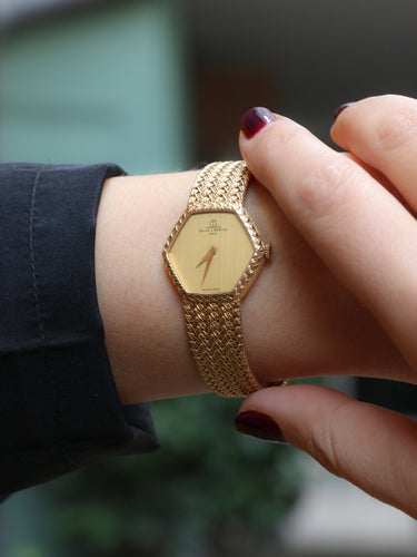 Montre Baume & Mercier - Montre vintage en or jaune 18 carats à maille tressée 58 Facettes 1067.3