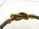 Bracelet FRED Force 10 Infinie - Bracelet grand modèle en or jaune 18k et acier 58 Facettes 271707