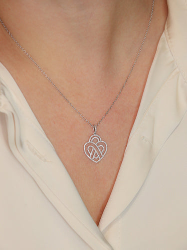 Collier Poiray - Collier cœur entrelacé en or blanc 18K et diamants 58 Facettes 1091.1