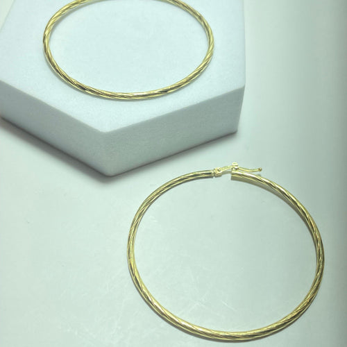 Minđuše Uvrnute zlatne minđuše od žutog zlata 18 karata, 8,64 g 58 Facettes 250315