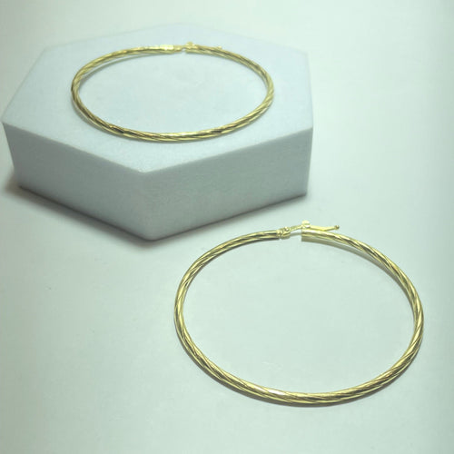 Minđuše Uvrnute zlatne minđuše od žutog zlata 18 karata, 8,64 g 58 Facettes 250315