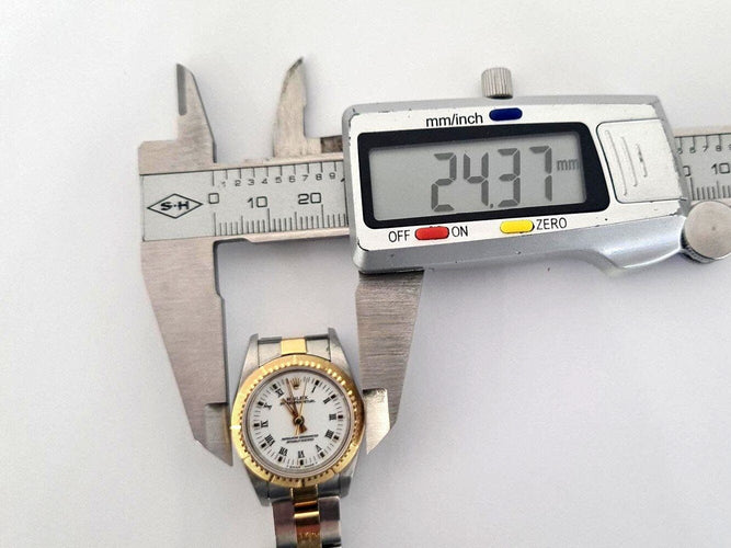 Montre Rolex Oyster Perpetual Lady 67243 - Montre automatique 24 mm acier et or jaune 58 Facettes 272072