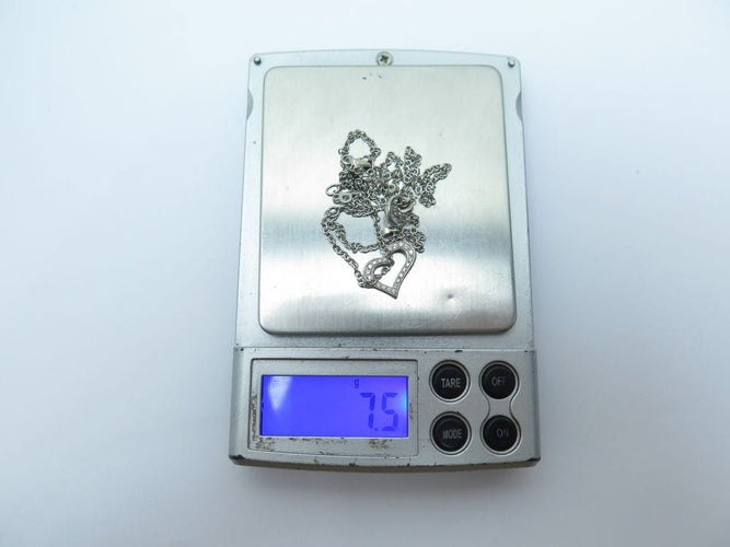 Collier Piaget Limelight - Collier chaîne Y avec pendentif cœur en or blanc et diamants 0,29 ct 58 Facettes 221585