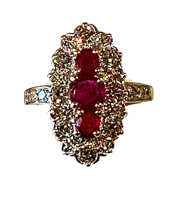 Marquise ring in gold, diamonds and rubies.