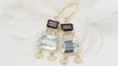 Boucles d'oreilles Boucles d'oreilles en or jaune 18 ct, aigue-marine et grenats 58 Facettes 31504