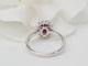 Bague 54 Bague entourage en or blanc 18 ct, rubis 0,95 ct et diamants 58 Facettes 33179