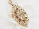 Pendentif Broche pendentif en or jaune 18 ct, émeraude, grenats et perles 58 Facettes 33147