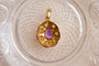 https://www.noircarat.fr/wp-content/uploads/2024/05/Pendentif-oval-Amethyste-et-Peridots-pendentif-de-seconde-main.jpg