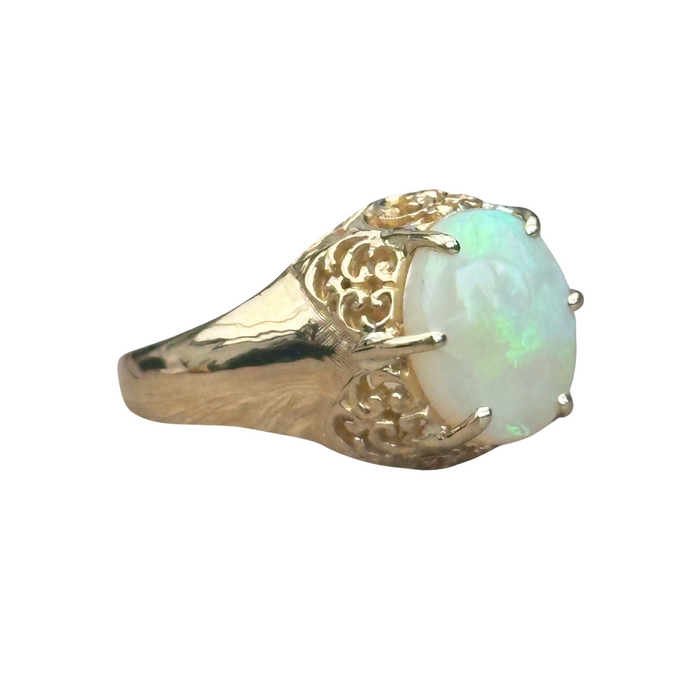 Old openwork ring set with a cabochon opal