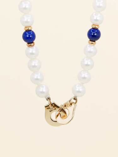 Collier Dinh Van Menottes R10 - Collier en or jaune 18 carats, perles et lapis-lazuli 58 Facettes 1204.7