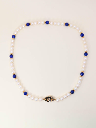 Collier Dinh Van Menottes R10 - Collier en or jaune 18 carats, perles et lapis-lazuli 58 Facettes 1204.7