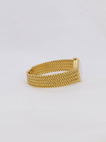 Montre Baume & Mercier - Montre vintage en or jaune 18 carats à maille tressée 58 Facettes 1067.3