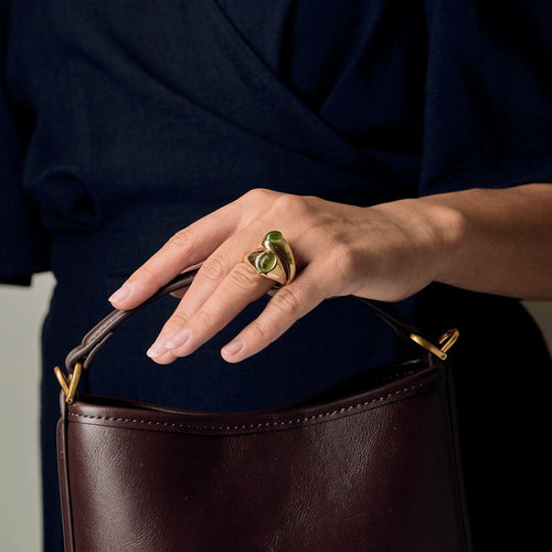 Bague 51 POMELLATO - Bague entrelacées en or jaune et péridots 58 Facettes DV2312-12