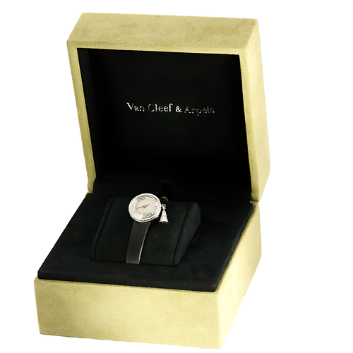VAN CLEEF & ARPELS - Montre en or blanc et diamants à boitier rond et mouvement quartz