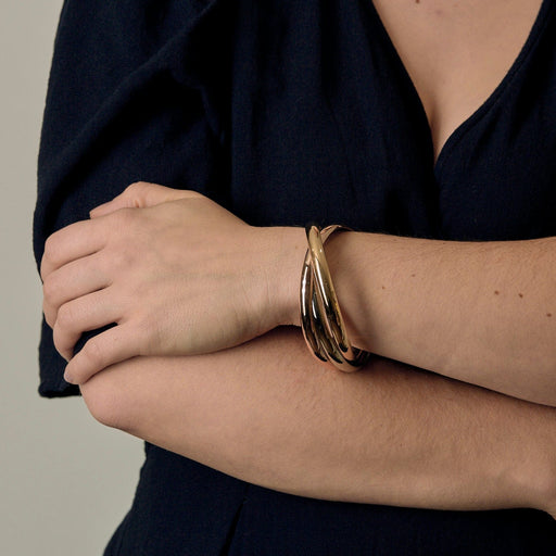 CARTIER - Trinity - Vintage-rannekoru, jossa kolme toisiinsa kietoutunutta rengasta