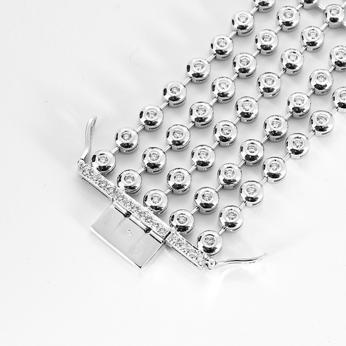 Båndarmbånd i hvitt gull og diamanter