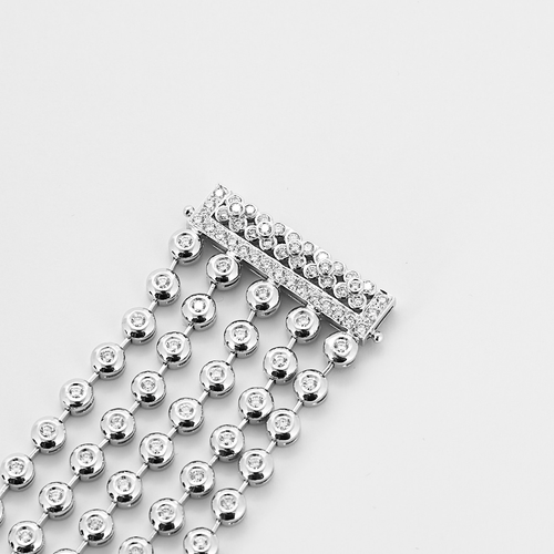 Båndarmbånd i hvitt gull og diamanter