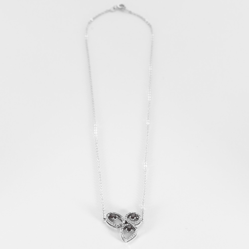 Halskæde i gråt guld, diamanter og rubiner