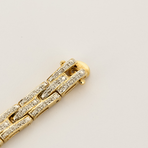 Bracelet en or jaune articulé et diamants