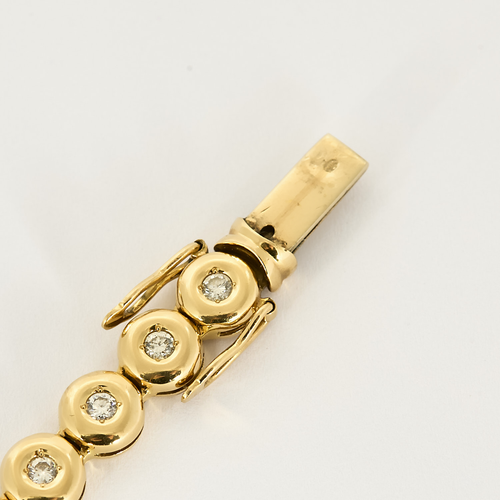 Armbånd i gult gull og diamanter