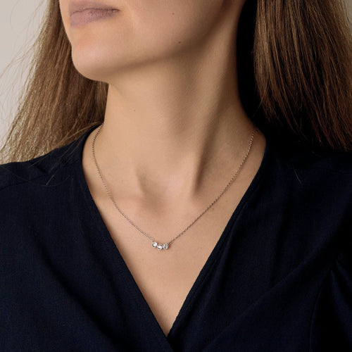 Necklace in grey gold, platinum and three diamonds.